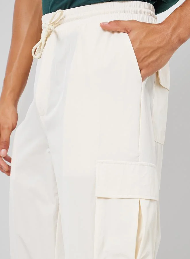 Styli  Men Off White Relaxed Cargo Pants for Men | Best Price UAE